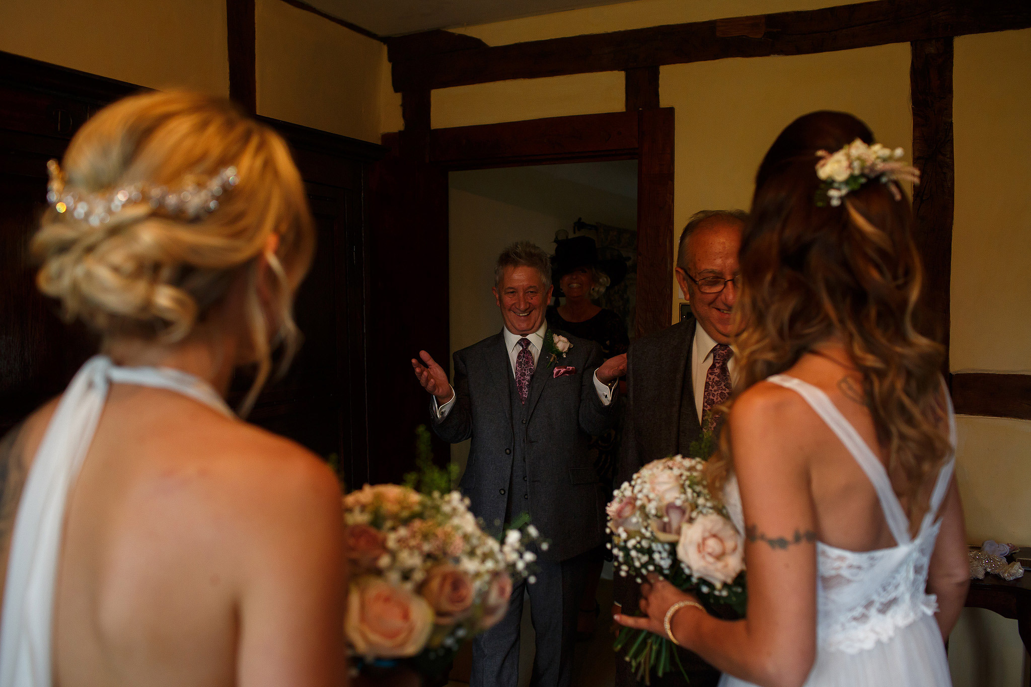 Father of the brides seeing their daughters for the first time in their wedding dresses - great hall at mains wedding photography