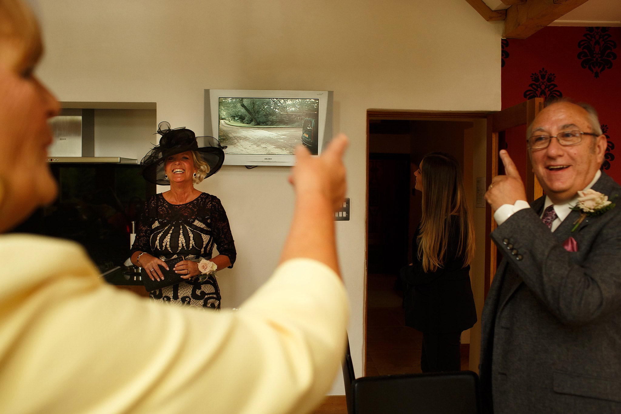 Family awaiting the arrival of the brides inside the house - great hall at mains wedding photography