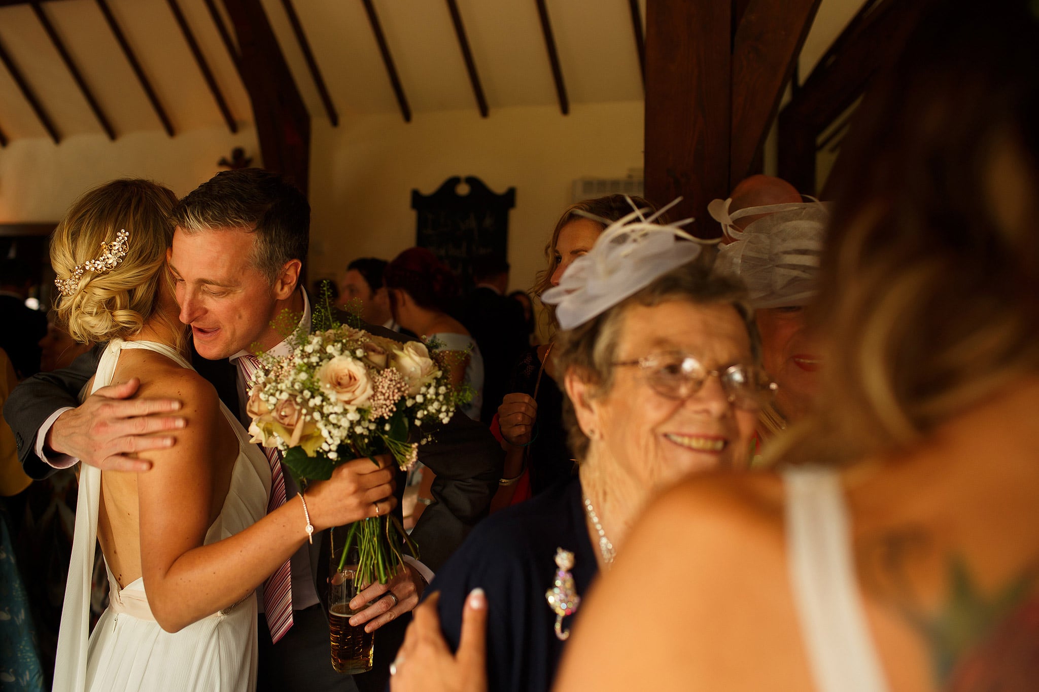 Family congratulating the newly wed brides after wedding ceremony - great hall at mains wedding photography