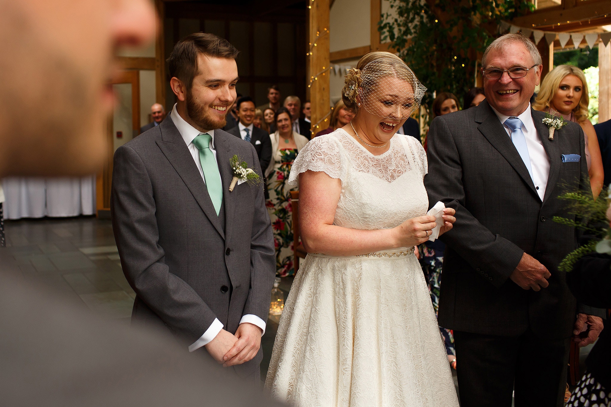 Bride with blonde hair and bird cage veil on wedding day at the Oak Tree at Peover