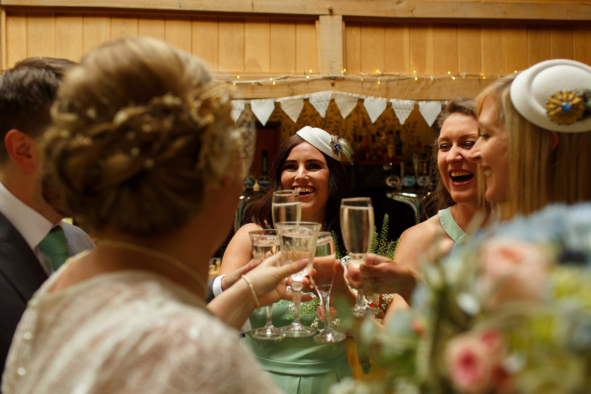 Wedding guests laughing during Oak Tree at Peover civil ceremony