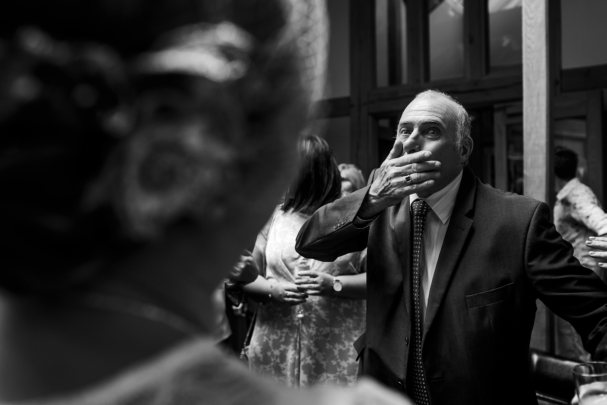 Award winning photograph of elderly relatives congratulating bride on wedding day 