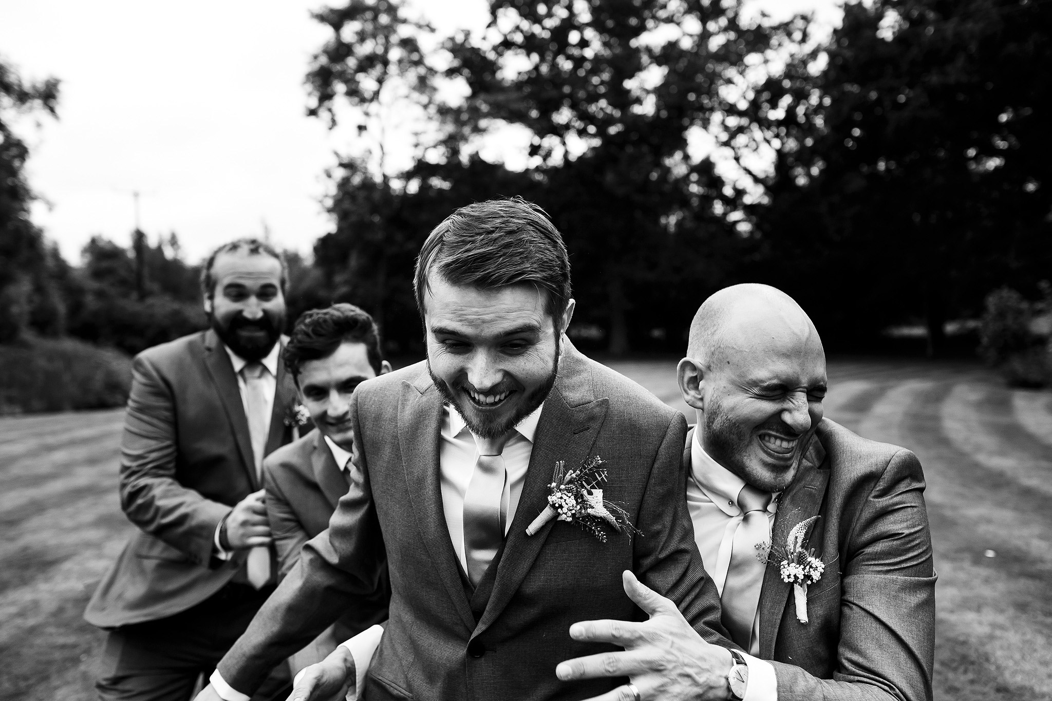 Wedding guests laughing during Oak Tree at Peover civil ceremony