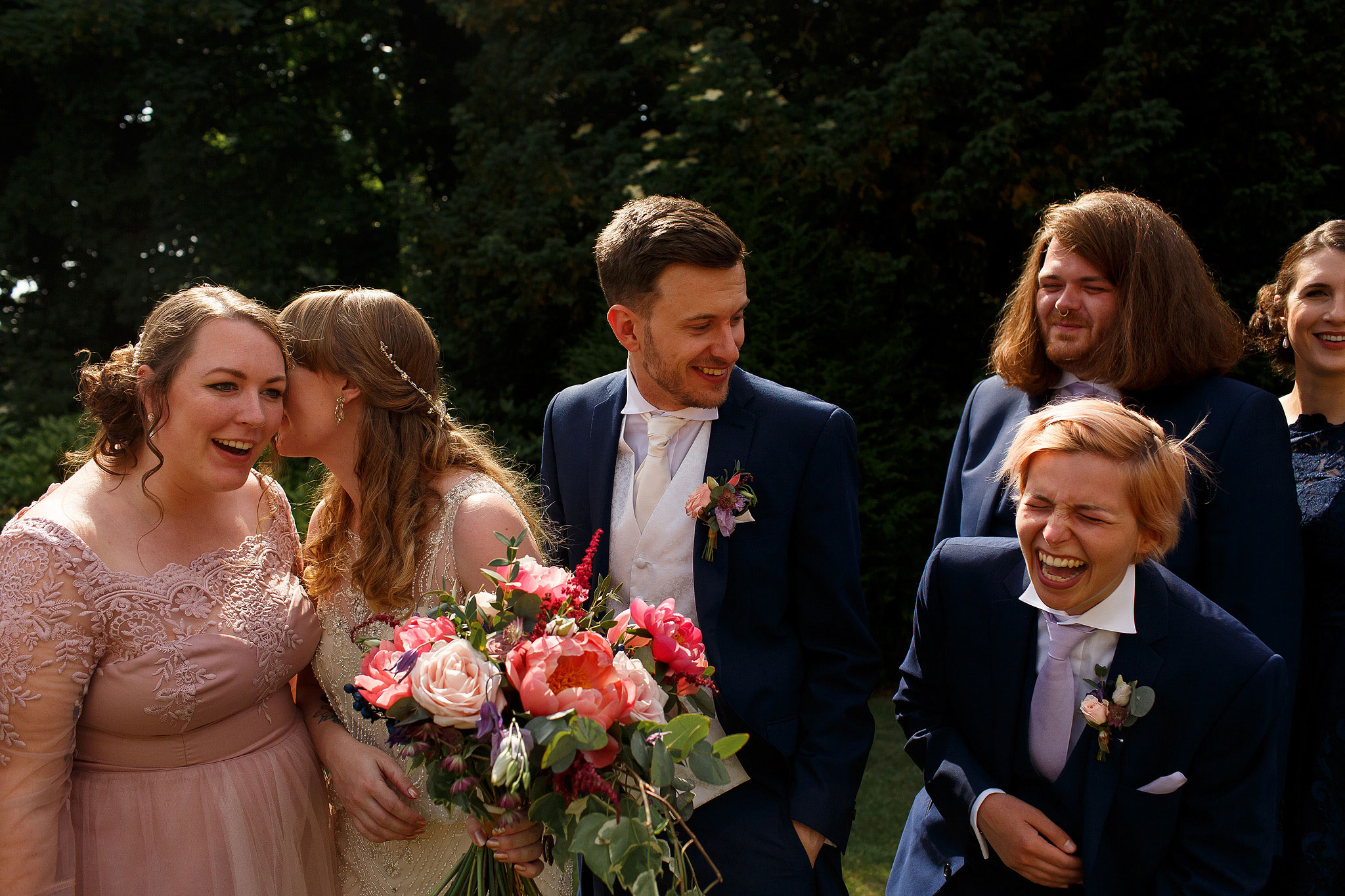 Bridesmaids and groomsmen laughing during bridal party portraits - The Villa at Wrea Green Wedding Photography - Toni Darcy Photography