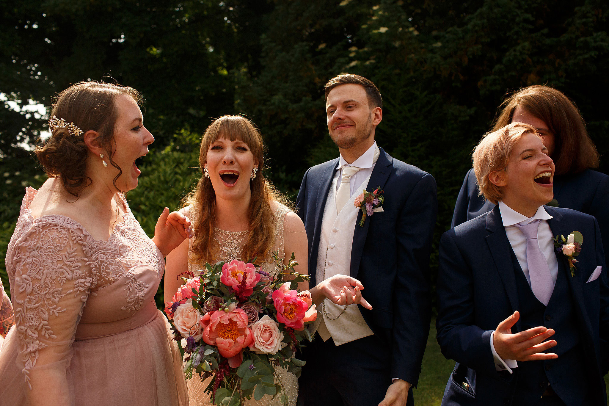 Bridesmaids and groomsmen laughing during bridal party portraits - The Villa at Wrea Green Wedding Photography - Toni Darcy Photography