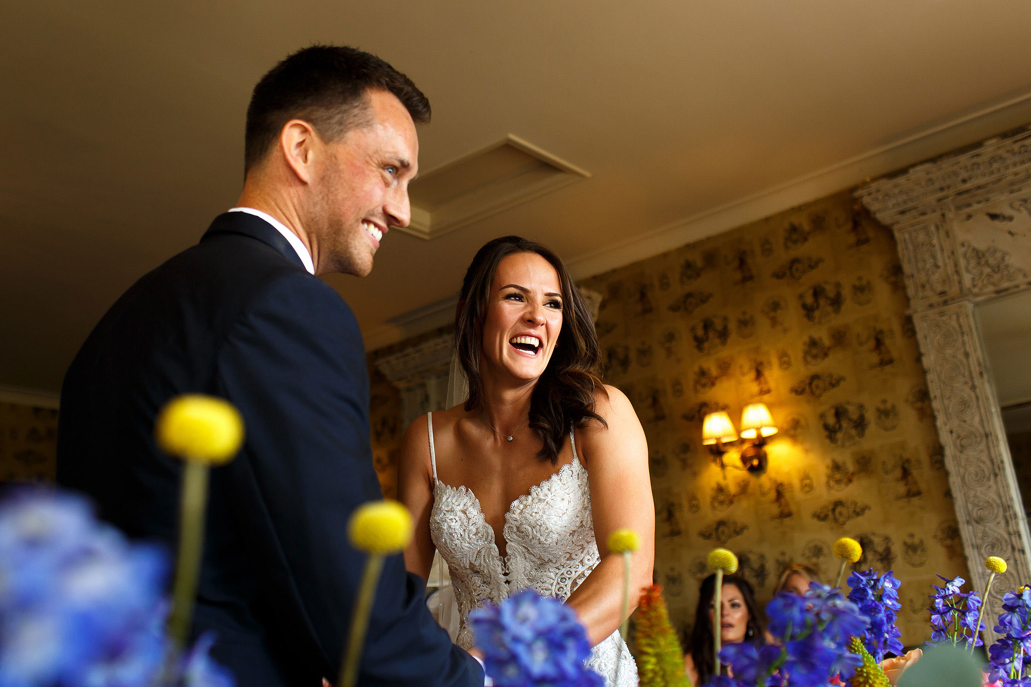 Bride and groom laughing during wedding ceremony at the Shireburn Arms