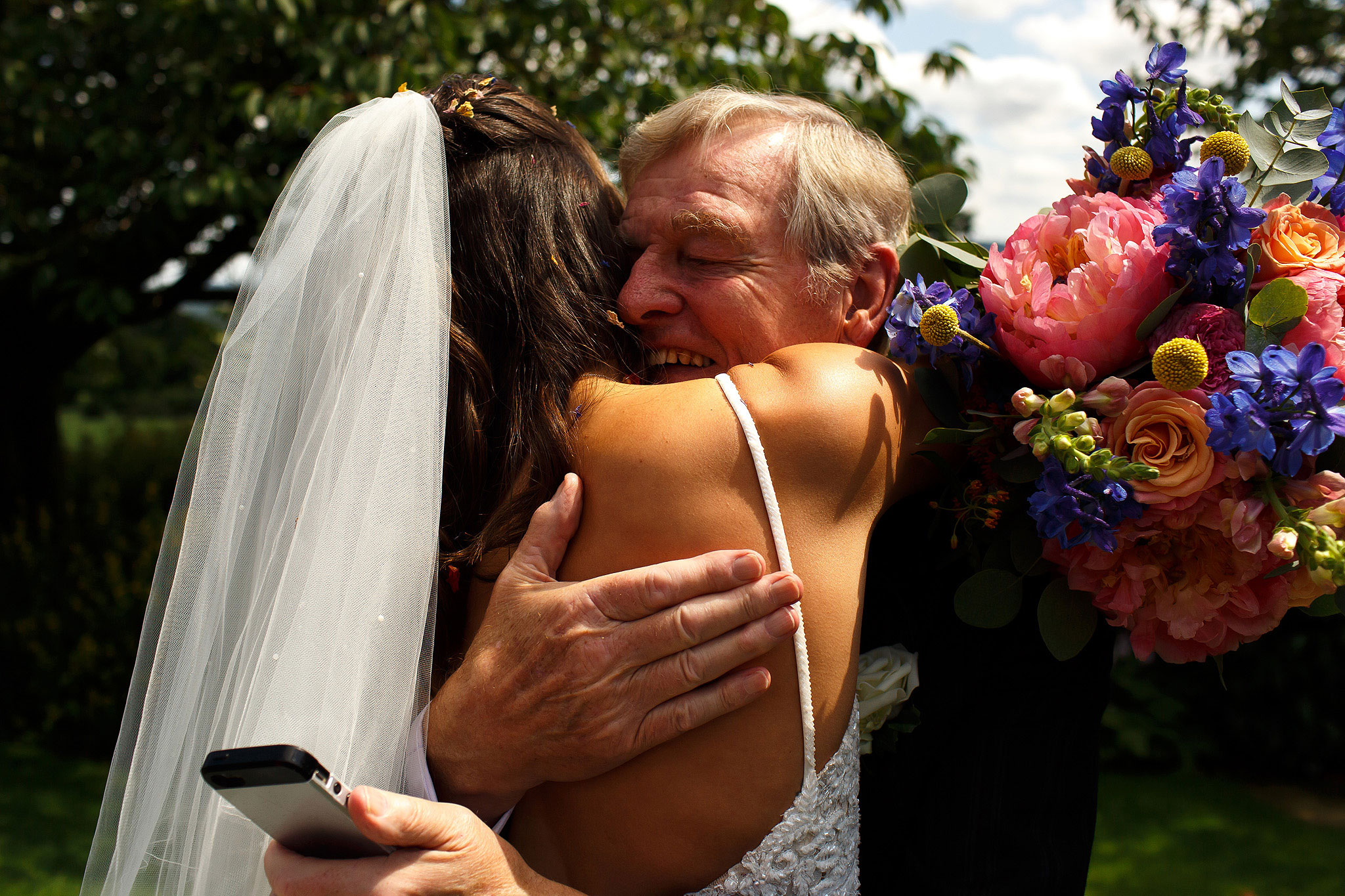 Bride hugging grandfather