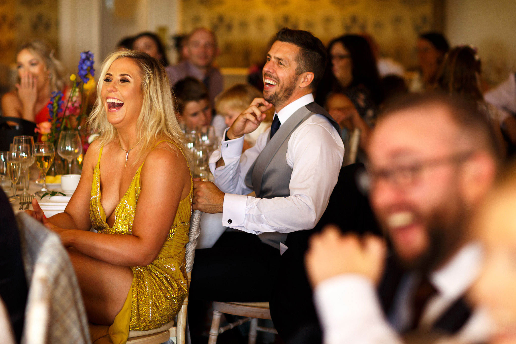 Guests laughing during speeches at Shireburn Arms