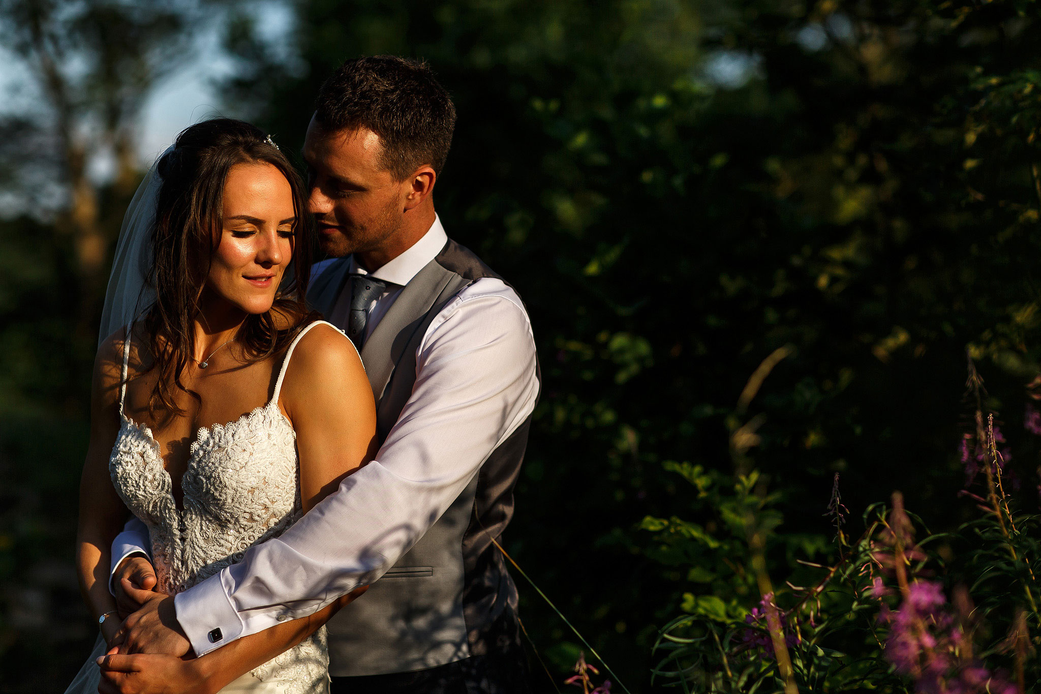 Bride and groom stood on Cromwell Bridge during Shireburn Arms wedding