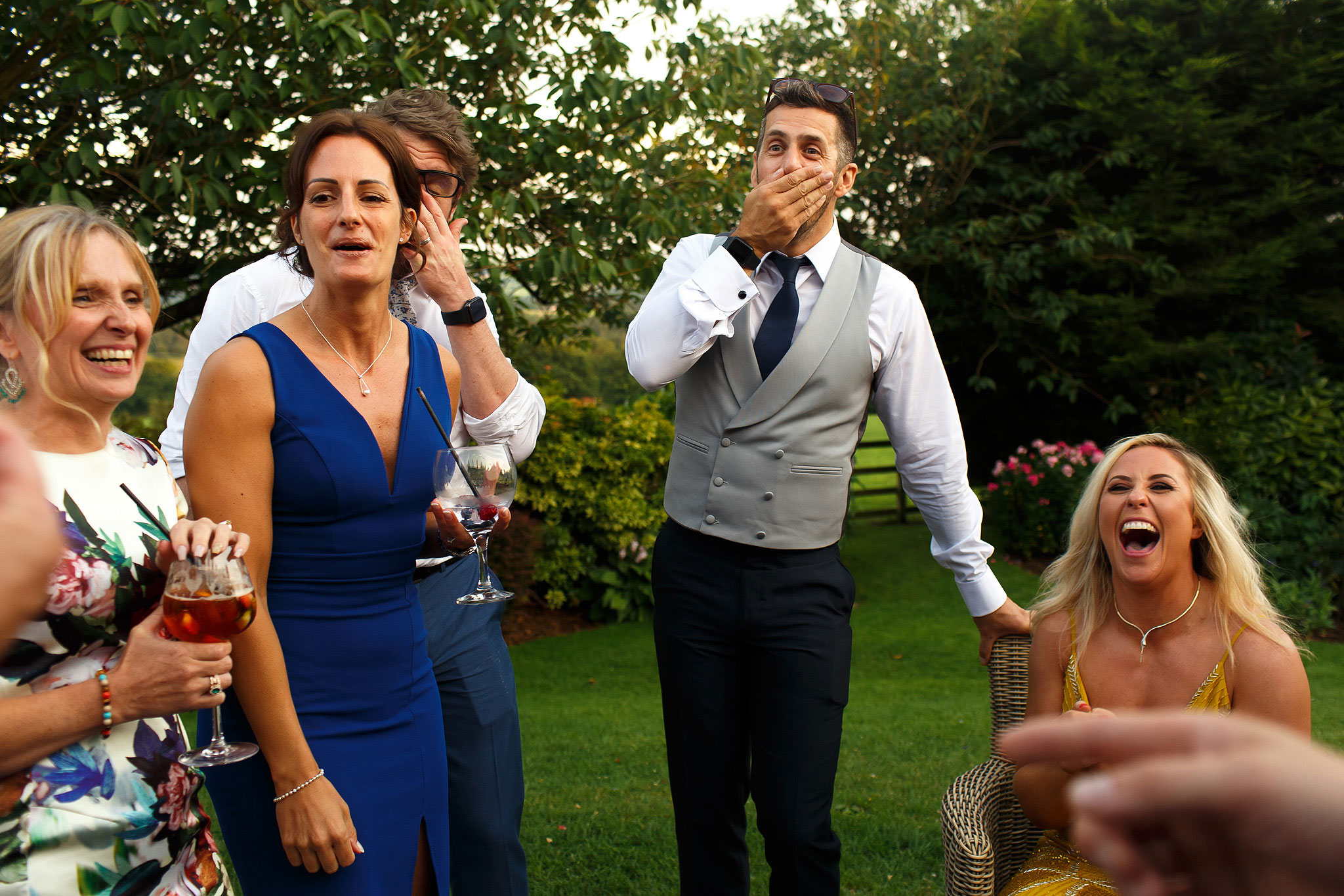 Wedding guests laughing during Shireburn Arms drinks reception