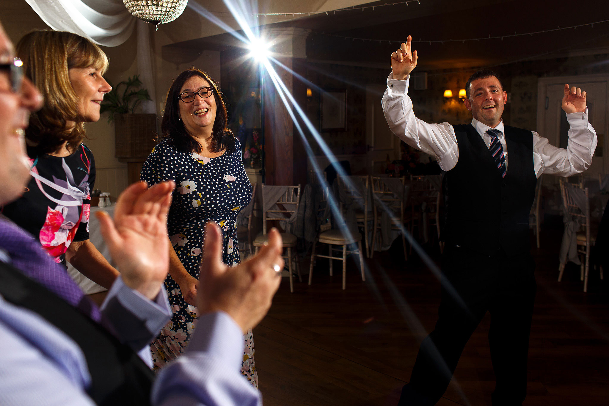 Guests on the dance floor during evening wedding reception at the Shireburn Arms