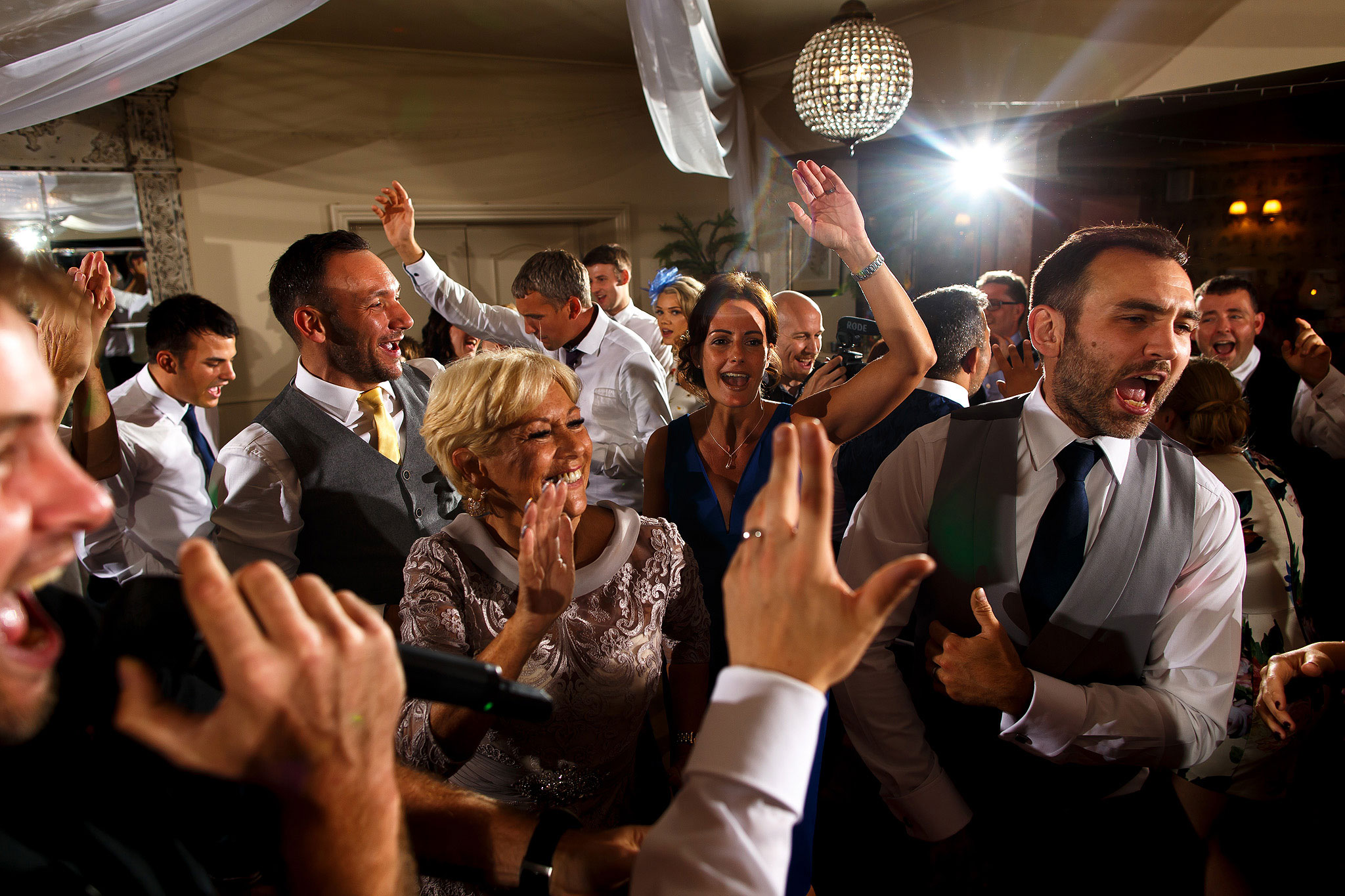 Guests on the dance floor during evening wedding reception at the Shireburn Arms