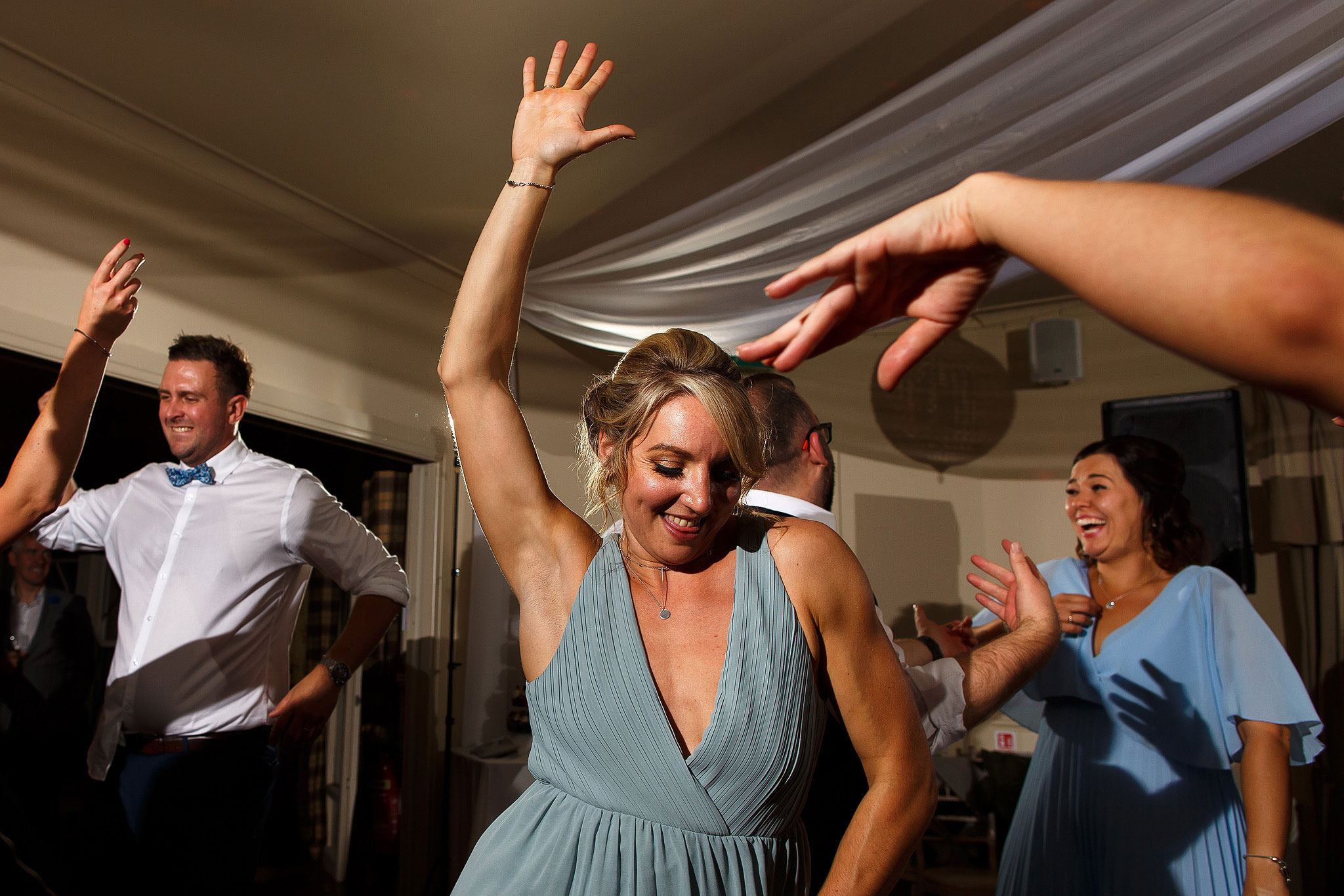 Guests on the dance floor during evening wedding reception at the Shireburn Arms