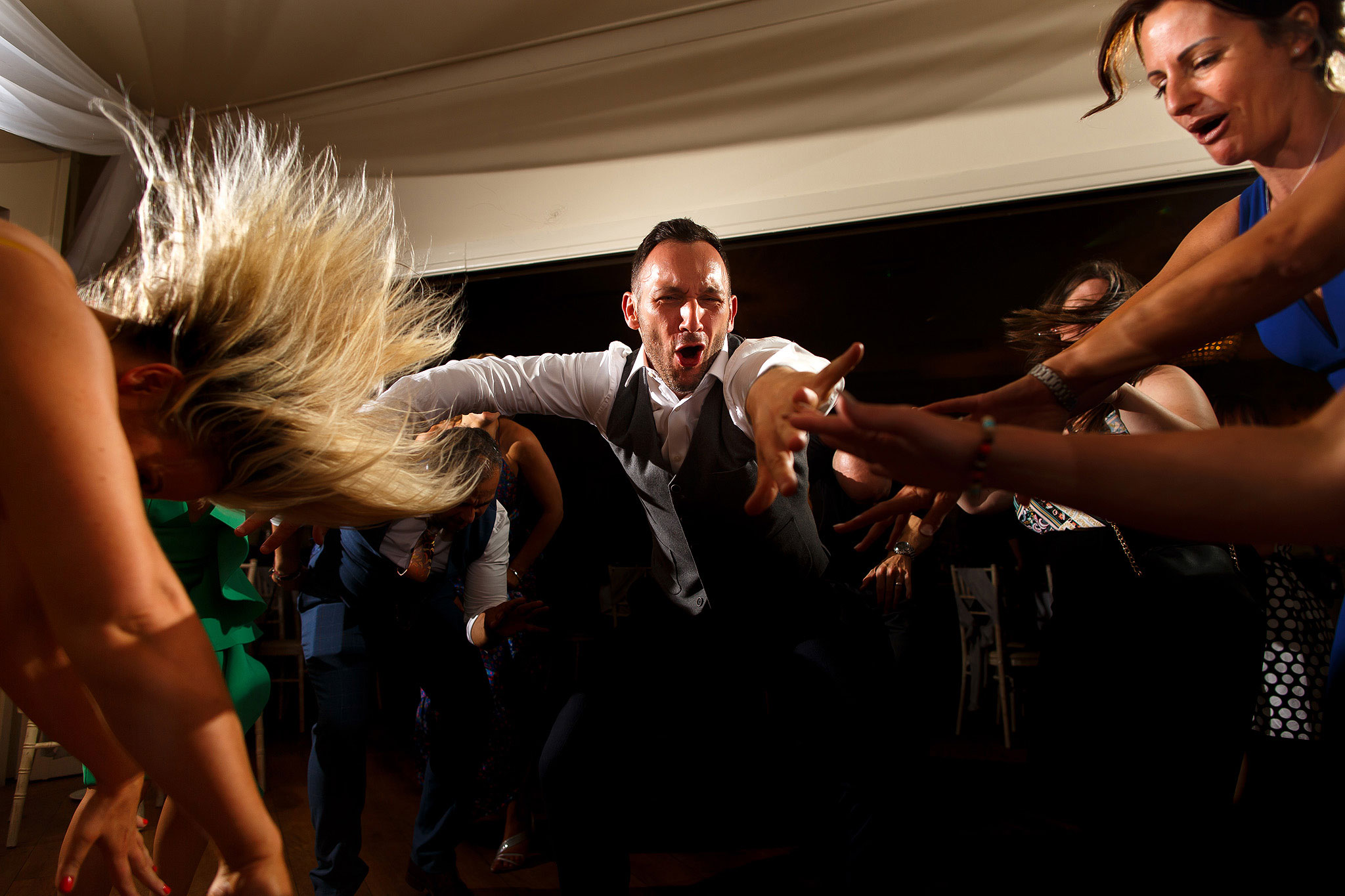 Guests on the dance floor during evening wedding reception at the Shireburn Arms