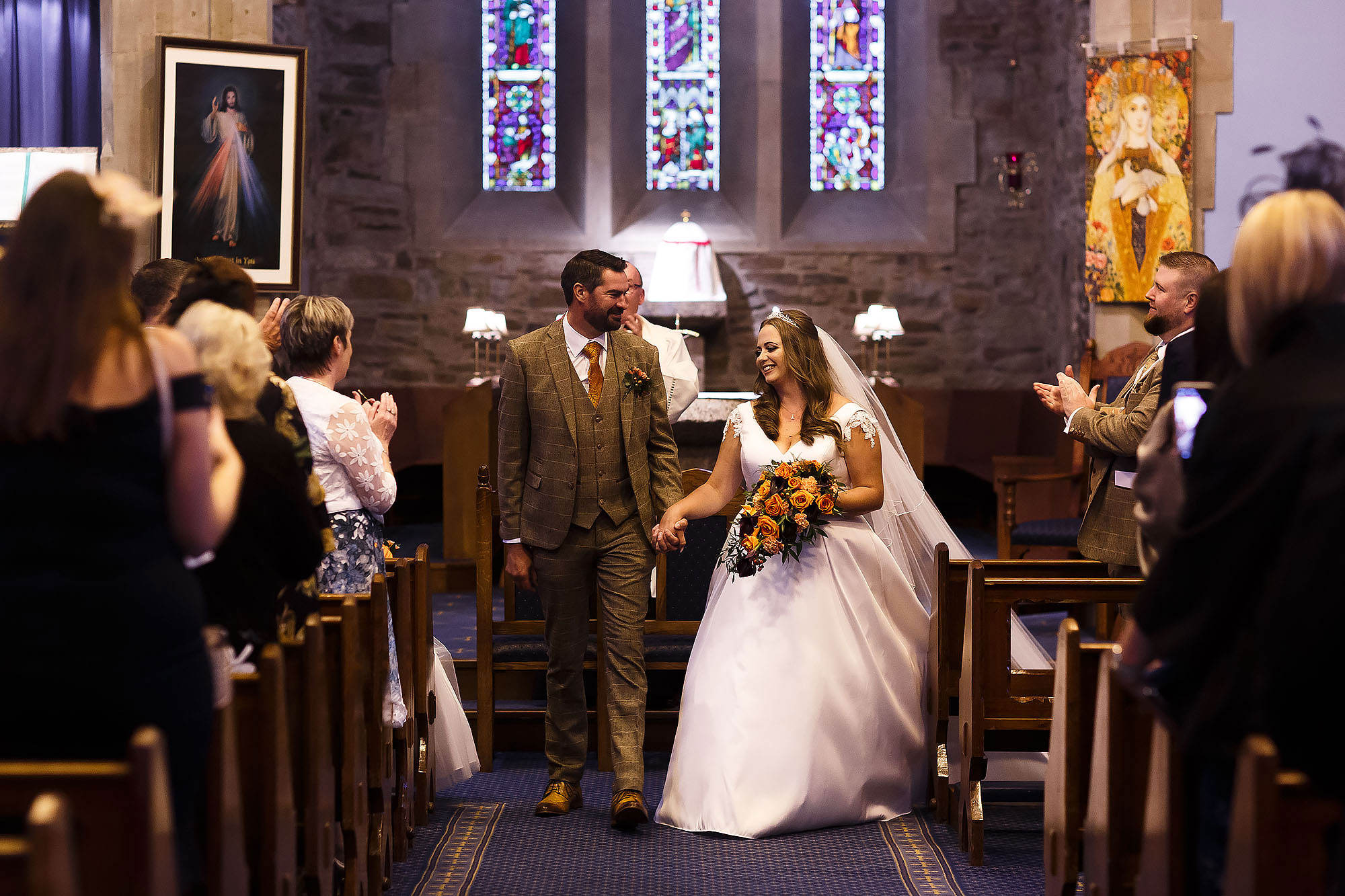Bride and Groom walking down the aisle as husband and wife at St James the Less Rawtenstall | Wellbeing Farm wedding photographs by Toni Darcy Photography