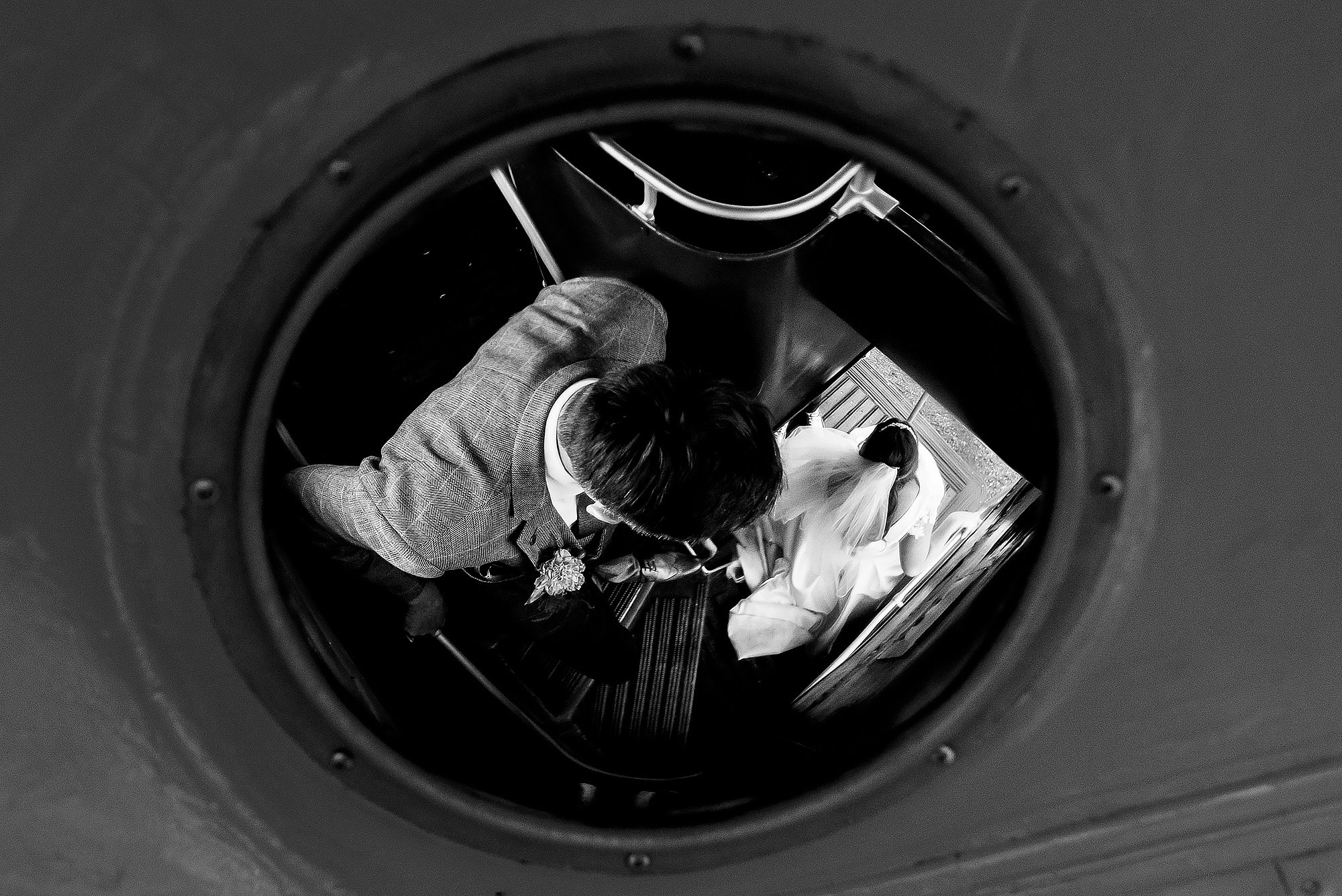 Bride and groom walking down the stairs of the wedding bus | Wellbeing Farm wedding photographs by Toni Darcy Photography