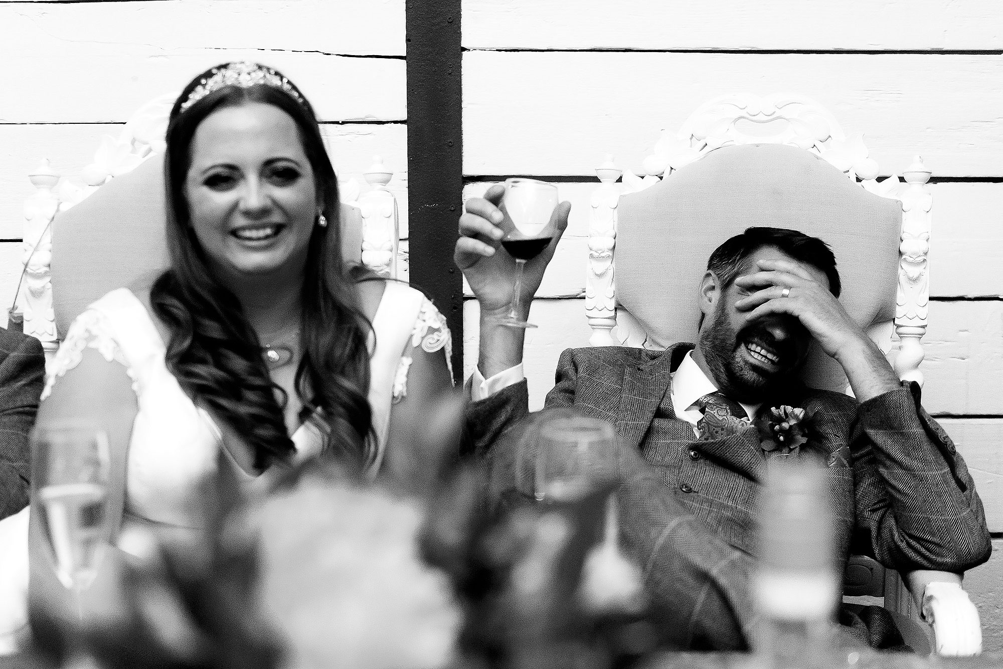 Bride and Groom crying laughing during wedding speeches | Wellbeing Farm wedding photographs by Toni Darcy Photography