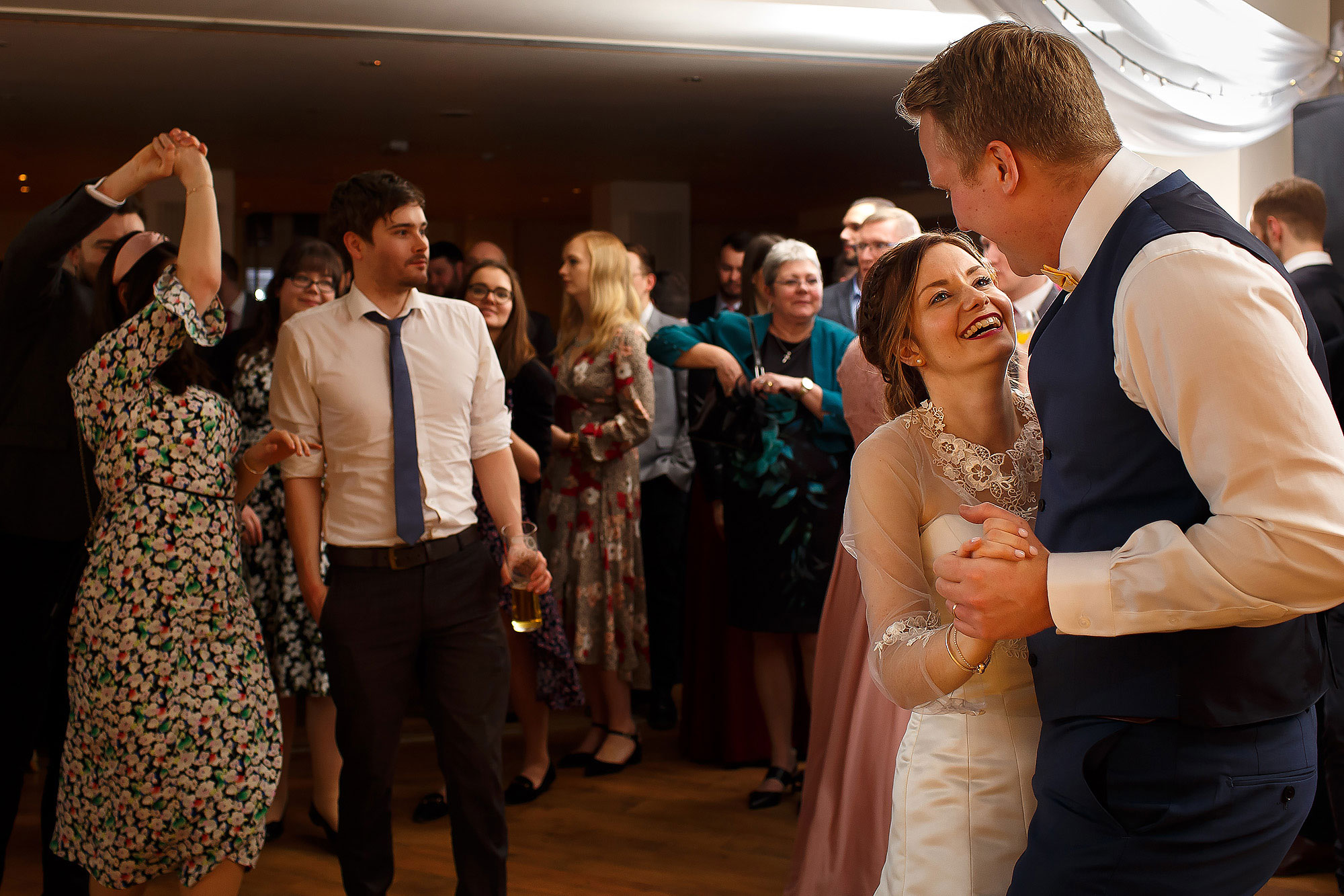 Bride and groom dancing in each others arms on the dance floor | Mitton Hall wedding photographs by Toni Darcy Photography
